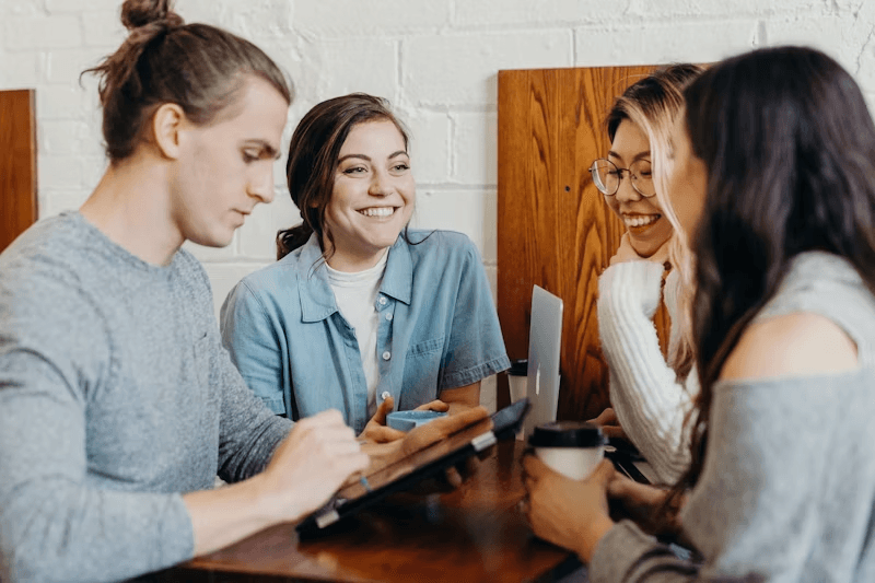 Friends in warm conversation around a table